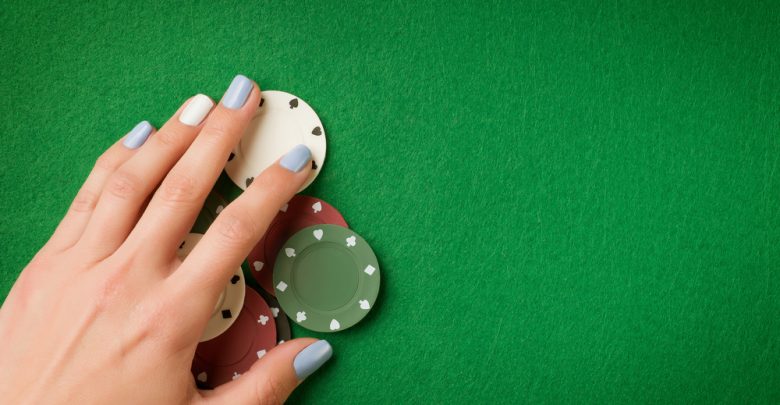 live dealer - image of hand and chips on a table