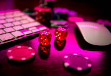 fast payout casino: Online casino. Online poker. On the table there are game pieces and dice next to the keyboard. Game chips for betting in gambling. Dice. Poker chips.