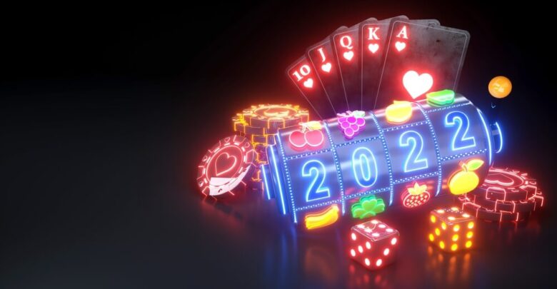 2022 Year Online Casino Gambling Concept. Royal Flash Poker Cards, Slot Machine, Dices And Roulette Wheel With Neon Lights - 3D Illustration